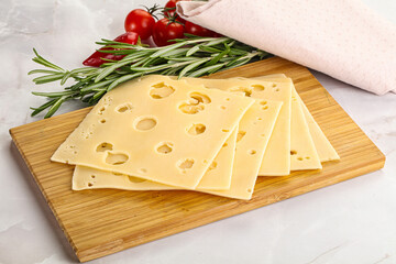 Sliced maasdam cheese with holes