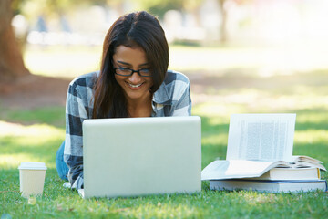 Laptop, lawn or happy woman in park with books for learning knowledge, information or education....