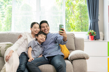 happy family take a selfie at home