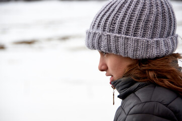portrait of profile a young woman in winter.
