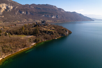 Kayak trip on the Lac du Bourget in Aix-Les-Bains, with aerial view by dorne of the canal from Savières to Chatillon, between castle, mountains and river in Savoie