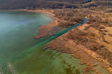 Kayak trip on the Lac du Bourget in Aix-Les-Bains, with aerial view by dorne of the canal from Savières to Chatillon, between castle, mountains and river in Savoie