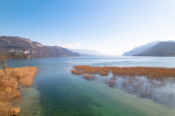 Kayak trip on the Lac du Bourget in Aix-Les-Bains, with aerial view by dorne of the canal from Savières to Chatillon, between castle, mountains and river in Savoie
