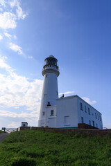 Fototapeta na wymiar Flamborough Lighthouse: A Beacon of Light in Yorkshire’s Coastal Beauty