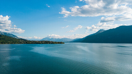 Photo of the Lac du Bourget and the Dent du Chat, in Aix-Les-Bains in Savoie, France - obrazy, fototapety, plakaty
