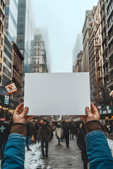 Fototapeta na wymiar People person hands holding showing blank white empty paper board banner card billboard note board sign on street for text advertising message, protest concept