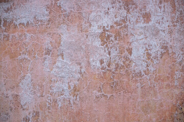 Subtle Erosion: The Worn Surface of a Pink Wall