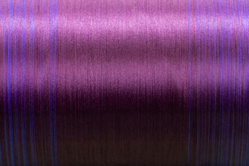 Closed up of violet color of thread textured background (Focus at center of picture)