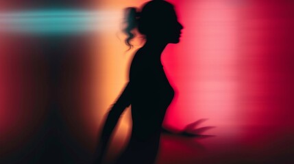 Female silhouette on a red gradient background. Elegant outline of a woman in motion out of focus