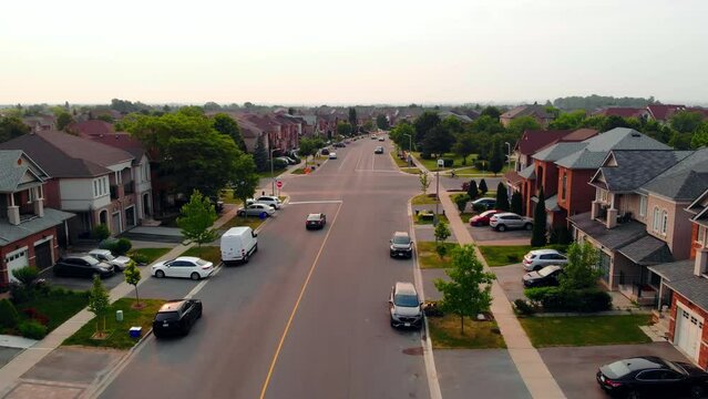 Road traverses scenic US suburb, a picturesque setting for road enthusiasts. Ideal for showcasing road life in tranquil neighborhoods, capturing the essence of suburban road in peaceful environments.