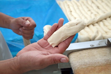 French bread dough prepared and placed on a tray to go into the oven