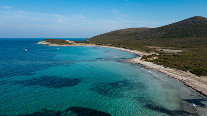 Drone photography genoise tower, cala and barcaggio beach with turquoise waters in Cap Corse 