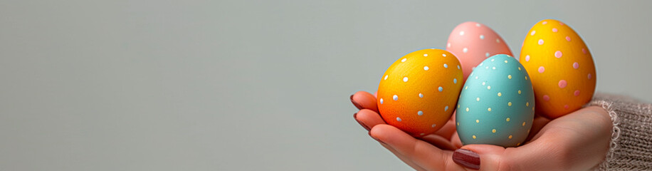 woman hand holding easter eggs, Happy Easter banner image with copyspace, front view