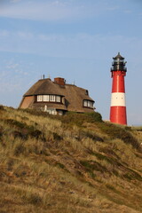 Fototapeta na wymiar Red Lighthouse on the island of Sylt in North Frisia, Schleswig-Holstein, Germany