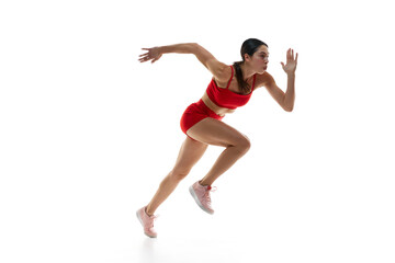 Competitive, concentrated young woman, runner athlete training, running against white studio background. Concept of sport, active and healthy lifestyle, sportswear, competition