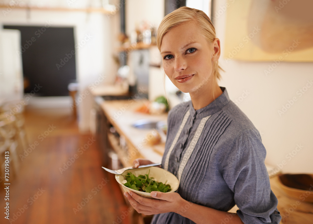 Poster Woman, portrait and salad bowl in kitchen or health nutrition for wellbeing, ingredients or fibre. Female person, face and wellness or vegan meal in apartment for diet leafy greens, food or cooking