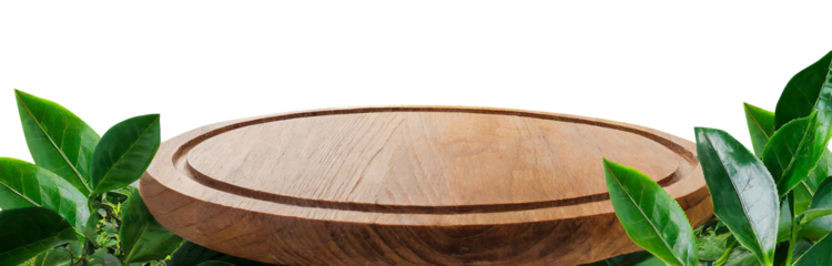 Empty round wooden table on transparent background of green leaves and tea plantation