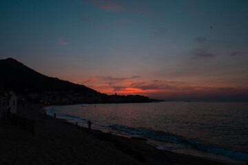 Long exposure photography of a sunset on a beach by the sea in Corsica