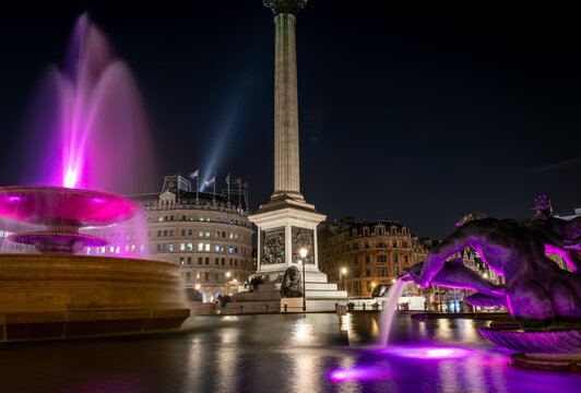 London. UK- 02.04.2024. A long exposure night time view of Trafalgar Square showing the water fountains and Nelson's Column.