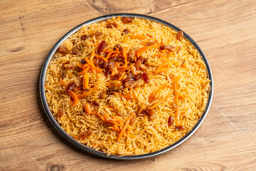 Bukhari rice mansaf on a wooden floor