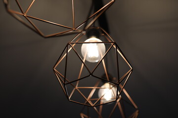 Chandelier details close-up. Diamond-shaped chandelier on the ceiling. Hanging chandelier with...