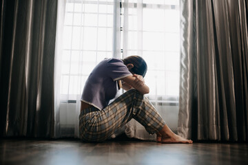 woman sit Depression Standing by window and anxiety Copy space. .