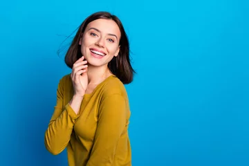 Gordijnen Photo of positive sweet lady dressed shirt arm cheek air blowing empty space isolated blue color background © deagreez