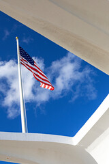 Majestic American Flag Waving Against a Clouds and Blue Sky on a Sunny Day