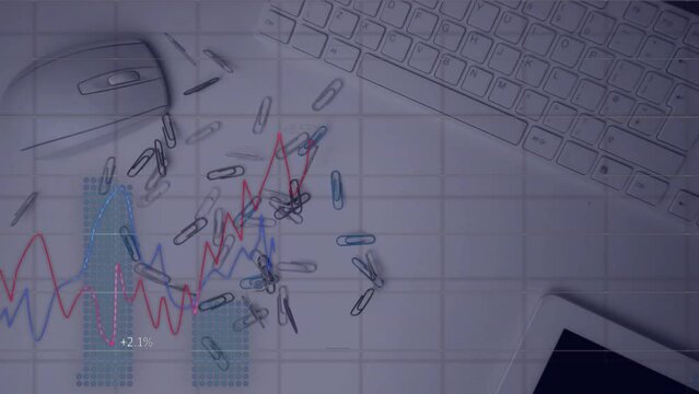 Animation of financial data processing over clips, mouse and keyboard on desk