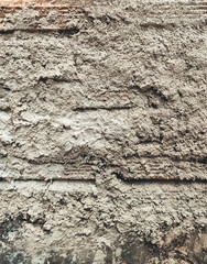 Cement on the wall. Solid gray cement for laying masonry