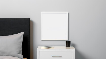 White square frame mock up on a grey wall under the bedside table. Notebook and glass on the table. Copy space Modern minimalistic Scandinavian interior. Photo frame template