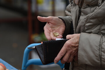Zagreb, Croatia : 01, 05, 2024 : Close-up of paying  with euros at the vegetable market in Zagreb.