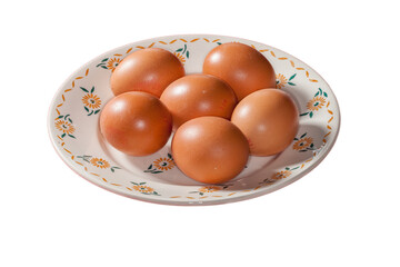 Six œufs dans une vieille assiette décorée 