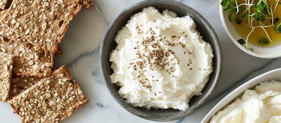 Overhead view of cream cheese with gourmet gluten-free seed crispbread.