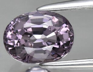 natural purple spinel gem on the background
