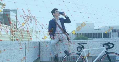 Animation of financial data processing over asian businessman drinking takeaway coffee - Powered by Adobe