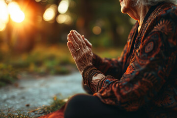 Elderly woman doing yoga outdoors, leisure activities for seniors healthy lifestyle - obrazy, fototapety, plakaty