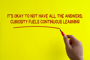 Hand writing It is okay to not have all the answer affirmation on yellow cover background....
