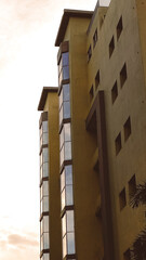 Portrait appearance of the building in the photo from below.