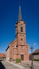 Mittelbergheim, France - 09 10 2020: Alsatian Vineyard. View of a typical Alsatian church  .