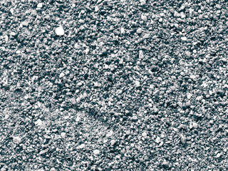 Sand and gravel on a seashore as nature background.