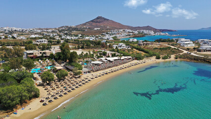 Aerial drone photo from sandy organised with umbrellas and sun beds beach of Pounta with crystal clear emerald sea, Paros island, Cyclades, Greece