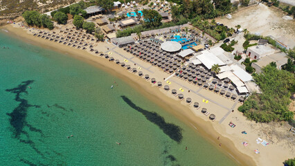Aerial drone photo from sandy organised with umbrellas and sun beds beach of Pounta with crystal...