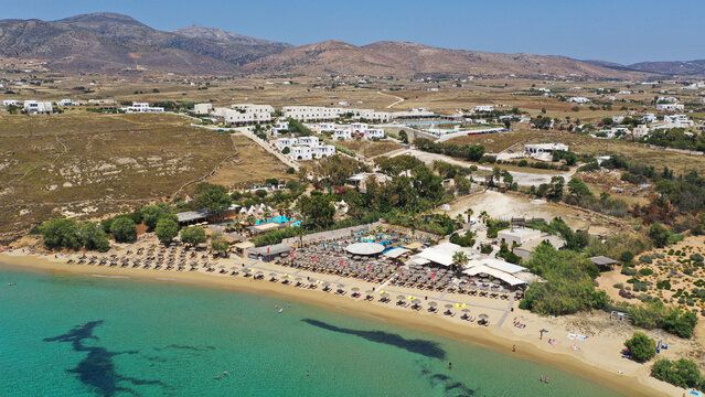 Aerial drone photo from sandy organised with umbrellas and sun beds beach of Pounta with crystal clear emerald sea, Paros island, Cyclades, Greece