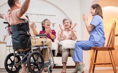 Group of happy elderly people, doctor talking together in community, playing game, consulting mental health, smiling with happiness, sitting in indoor nursing home. Retirement, Healthcare Concept.