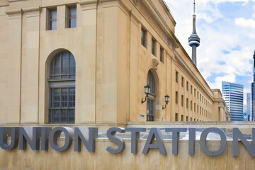 Union Station sign at Toronto Union Station with CN Tower in background 