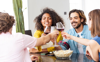 African afro woman, caucasian man wearing casual clothes, smiling with happiness, holding wine...