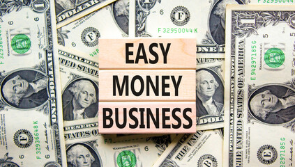 Easy money business symbol. Concept words Easy money business on beautiful wooden blocks. Dollar...