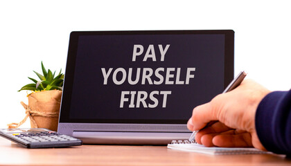 Pay yourself first symbol. Concept words Pay yourself first on beautiful tablet screen. Beautiful wooden table white background. Businessman hand. Business and pay yourself first concept. Copy space.