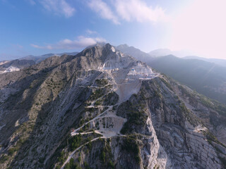 Fototapeta na wymiar Carrara Marble Quarry - Tuscany - Italy. Aerial panorama of marble quarries Carrara. .The scenic marble quarries in Carrara, Italy, where Michelangelo sourced materials for his famous sculptures.